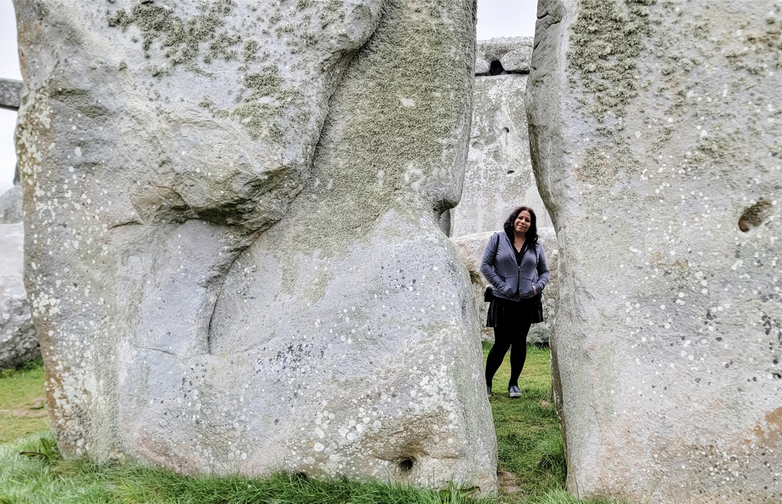 Standing between stones at stonehenge
